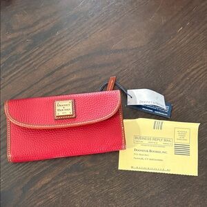 Dooney & Bourke Red Pebbled Leather Flap Wallet with Logo Plaque